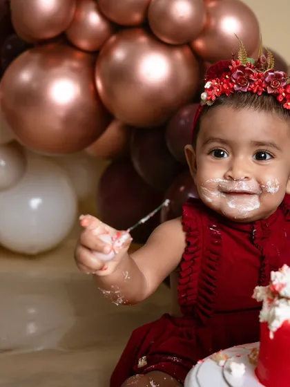 Let's make a mess! A first birthday cake smash is all about capturing pure, uninhibited fun. This little one is having the time of her life, and these are the memories you'll treasure forever.