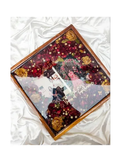 These images and videos showcase various angles and the creation process of my custom wedding and anniversary varmala preservation frames. Each one is made with love to turn your special memories into a timeless treasure.