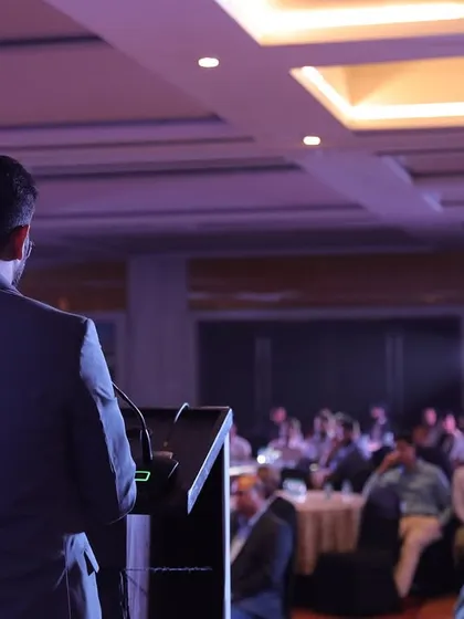 A view from the stage, addressing a full house at a corporate anniversary. As an event anchor, my job is to connect with every single person in the room, no matter how large the audience.