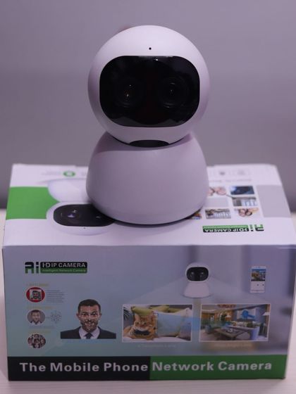 The AI HD IP Camera displayed on top of its retail box. This product is designed to be a complete mobile phone network camera solution for home and business.
