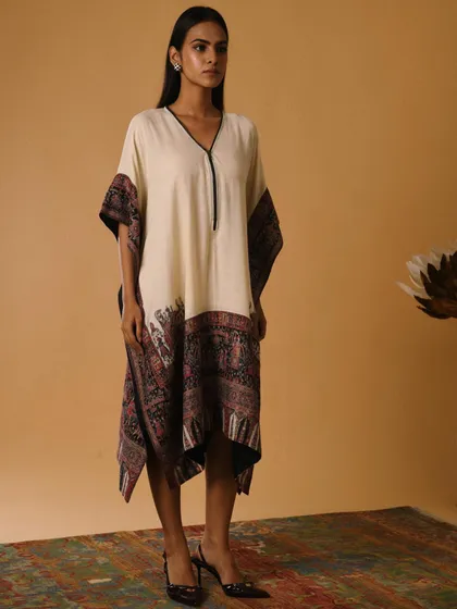 A beautiful printed kaftan styled for a resort wear collection. The easy, flowing silhouette makes it a versatile piece, and my styling aimed to highlight its effortless elegance for a festive holiday look.