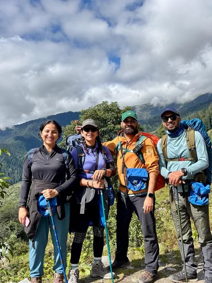 A group of happy trekkers on the Buran Ghati trail, fully equipped and ready for the adventure ahead.