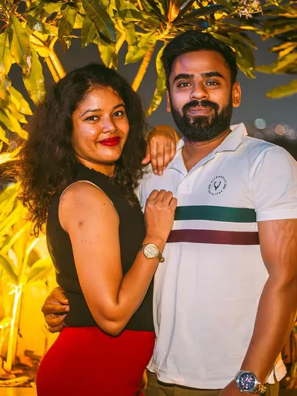 A couple posing in the outdoor area of TYD.