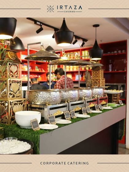 Another angle of a corporate event, this time featuring a green turf-lined counter. This creative touch brings a bit of the outdoors in and adds a fresh look to the buffet.