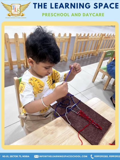 A young boy concentrates on his Eiffel Tower thread craft. This activity is a fantastic way to develop fine motor skills and patience while creating a famous European landmark.