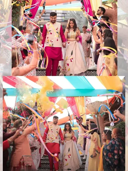 The couple's grand entrance at their Haldi carnival, greeted by a shower of colorful ribbons from their loved ones.