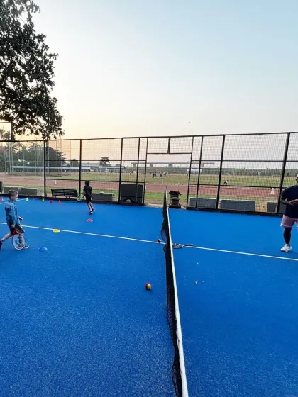 A typical evening batch in session, where kids work on drills using cones to improve their footwork and court positioning. Our training is structured to make learning systematic and effective.
