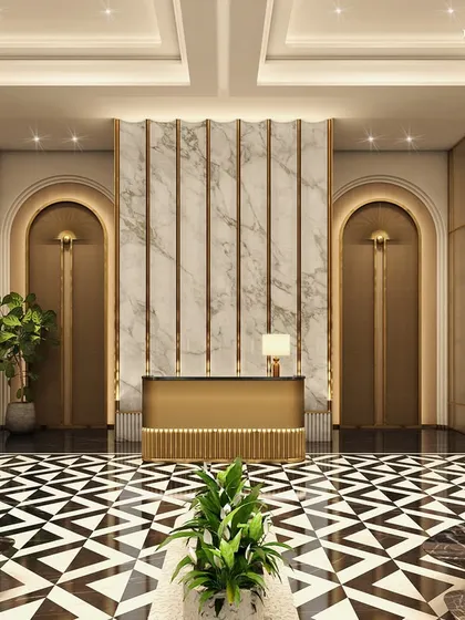 The elevator lobby at Empire Tower embodies Art Deco-inspired grandeur. The design is a celebration of timeless proportion and rhythmic geometry, with vertical fluting, bold geometric flooring, and elegant detailing drawing the eye upward.
