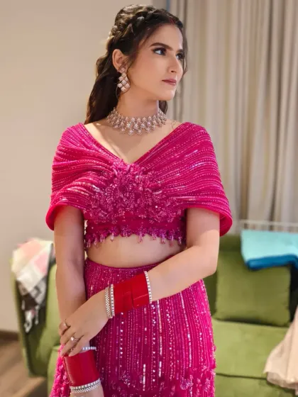 For a vibrant sangeet or reception, a full glam look can be magical. Here, I paired a shimmering pink eye with a glowing base and a modern hairstyle to match the energy of the celebration.