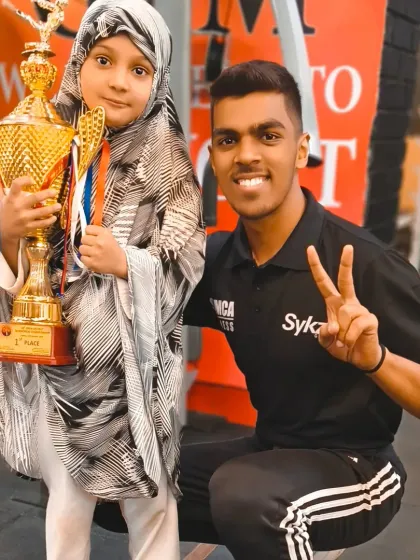 One of our instructors celebrates a student's victory. Our coaching team is deeply invested in the success of every single student.