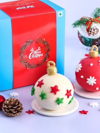 A pair of our beautiful hot chocolate bombs, designed to look like Christmas ornaments. They make for a unique and delightful holiday gift.