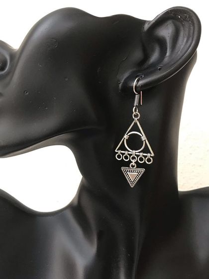 I love playing with shapes, and these geometric earrings are a great example. The triangular design gives them a modern, funky vibe while still being lightweight and easy to wear.
