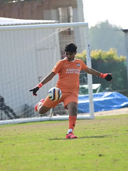 Our goalkeeper in action during the Dream Sports Championship, showcasing his confidence and technique as he prepares to distribute the ball.