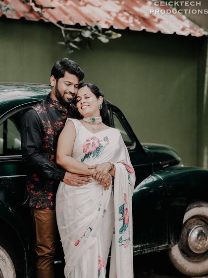 A sweet, romantic embrace with a classic dark green car in the background, blending vintage style with tender emotion.