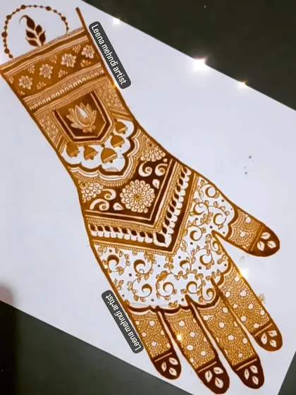 A beautiful practice design inspired by another artist. The pattern features a delicate vine pattern and a bold cuff with a lotus and jhumkas.
