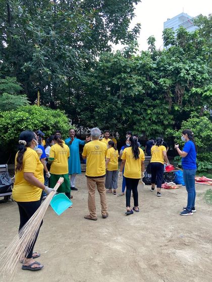 A group discussion before starting the cleanup. Planning and teamwork are key to our community service initiatives.