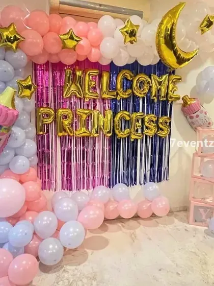 A 'Welcome Princess' home decoration with a pink and purple theme, a shimmer curtain, and moon and star foil balloons.