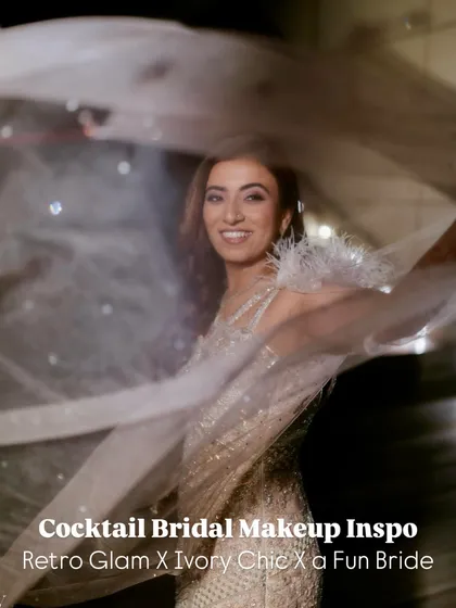 This bride is having fun with her cocktail look, and her makeup is designed to move with her. The soft shimmer and retro waves are perfect for a night of dancing.
