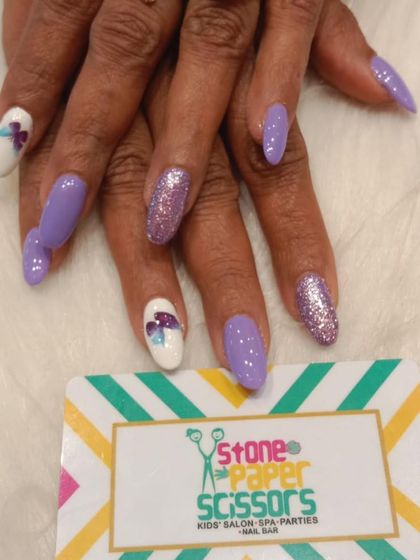 This purple-themed set is perfect for summer. It features solid purple nails, a full-coverage purple glitter nail, and a white accent nail with a hand-painted purple butterfly.