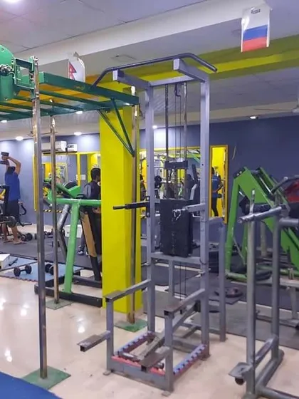 Our pull-up and dip station next to the monkey bars and cable machine. This setup is perfect for bodyweight strength training and can be integrated into any workout routine.