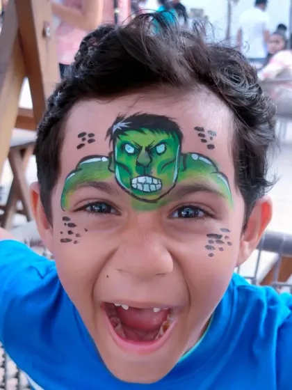 The reaction is everything. This full-face Hulk transformation brought so much excitement. I love creating superhero looks that make kids feel powerful and ready for adventure at their birthday parties.