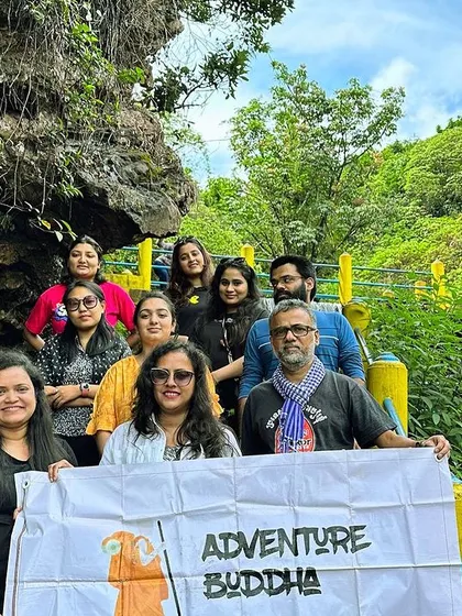 The group at the base of a waterfall in Chikmagalur, ready to explore.