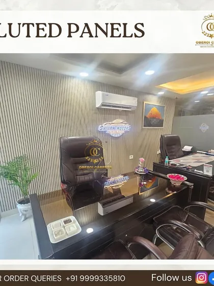 Another view of the office cabin from image 109, showing how the light-colored fluted panels create a bright and spacious feel.