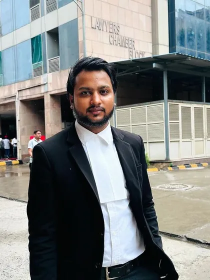 Dressed in my advocate's band and jacket outside the Lawyers' Chamber. Being formally ready is the first step to a successful day in court.