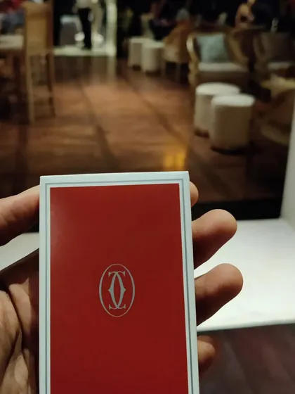 A custom-branded deck of cards from Cartier. It's these small, luxurious details that elevate a brand event and make it truly special.