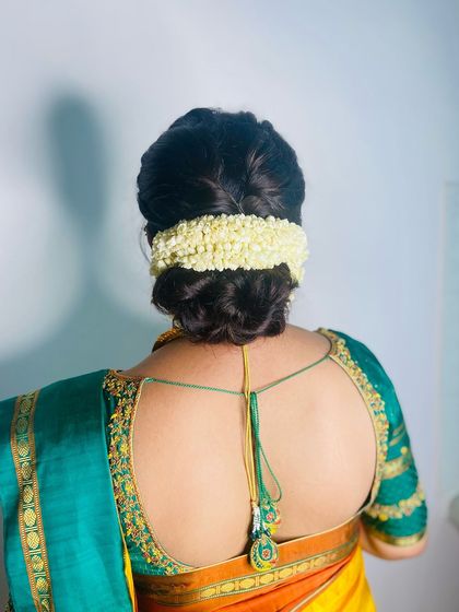 Another view of the jasmine-adorned bun. It's a fragrant and beautiful way to complete a traditional look.