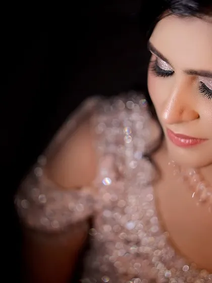 A soft and dreamy close-up of the bride. This portrait captures a moment of quiet contemplation and highlights her delicate features.