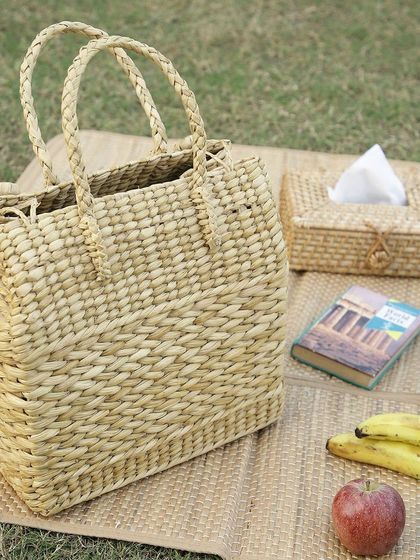 This image captures a serene picnic scene featuring our woven tote bag and matching tissue box cover. It highlights how our sustainable accessories are perfect for stylish, eco-conscious outdoor living.