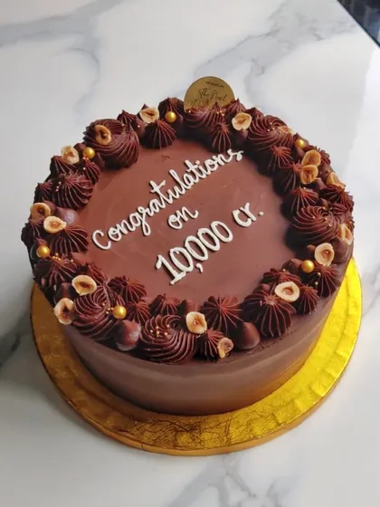 A rich Hazelnut Praline cake for a corporate celebration, congratulating them on a massive achievement. It's my go-to flavor for a guaranteed crowd-pleaser.