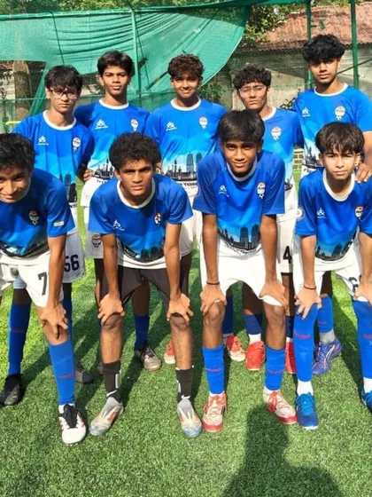 One of our U-15 teams in their blue kits, posing for a photo before their match in Goa.