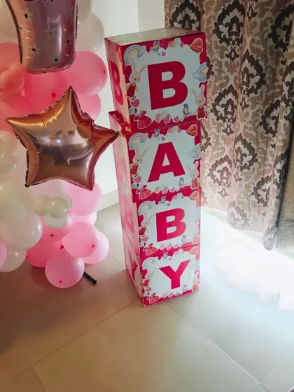 It's all in the details. These custom "BABY" blocks in a pretty pink design add a lovely, personalized touch to a baby girl's welcome home or baby shower decoration.