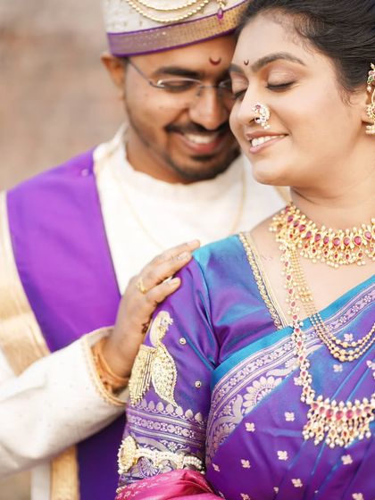 A tender moment, with the groom smiling down at his bride, their connection is palpable.
