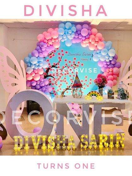 A duplicate image of the full stage for Divisha's fairy-themed first birthday, highlighting the symmetrical design and personalized elements.