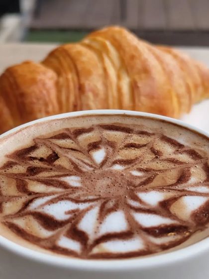 The perfect pairing: a warm, flaky croissant and a hot, expertly made coffee. It’s a simple pleasure that I love to share with my guests every day.