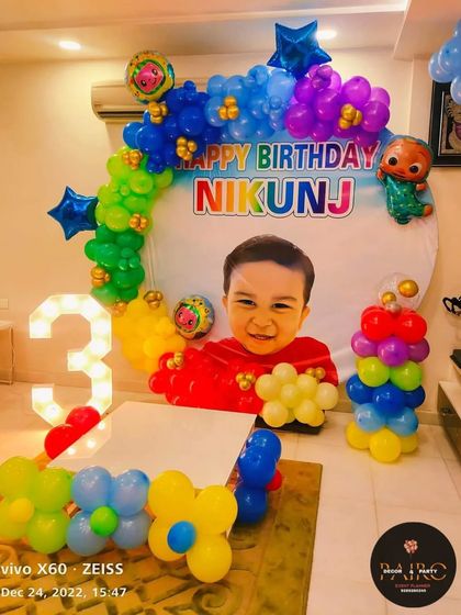 A personalized Cocomelon-themed backdrop for a 3rd birthday, featuring a large photo of the birthday boy.