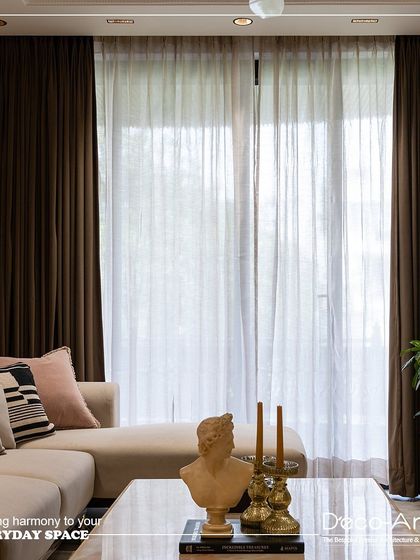 Elevating interiors with timeless elegance and subtle charm. This living room detail, featuring a classical bust and brass candle holders, shows how I curate every element to create a peaceful retreat at home.