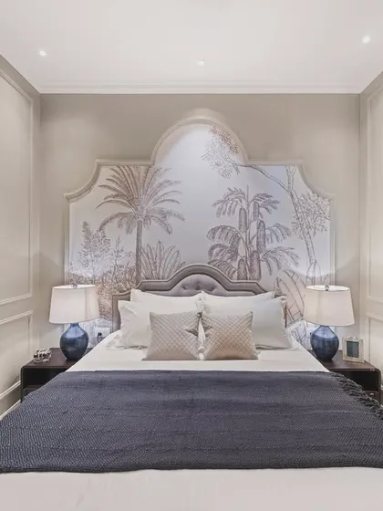 A symmetrical, wide shot of the monochrome bedroom, showcasing the statement wallpaper and the balanced arrangement of lamps and pillows. The image conveys a sense of harmony, style, and calm.