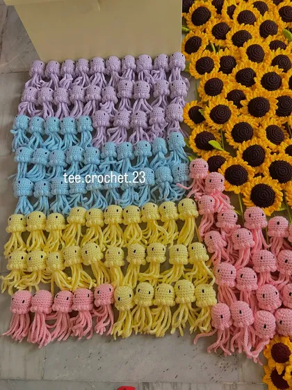 Rows of my pastel amigurumi jellyfish, a popular item for shop decor. This photo shows the consistent quality and cute design you can expect in a bulk order of my crochet characters.