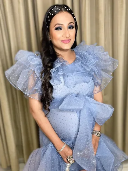 A gorgeous mommy-to-be glowing at her baby shower. I created a beautiful blue smokey eye to match her dress, but kept the rest of the makeup soft and radiant.