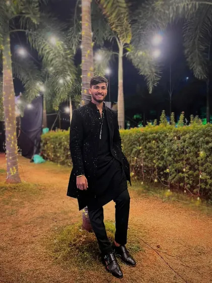 Leaning against a palm tree at a beautiful outdoor wedding venue. The atmosphere of an event always influences the music I play.