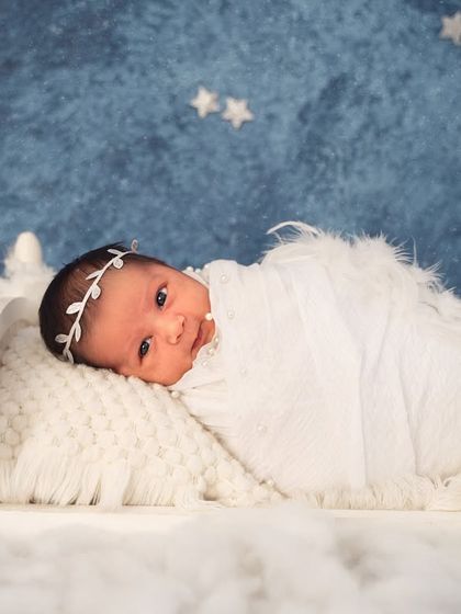 Wide awake and curious. Even when babies are not asleep, I can capture beautiful, angelic moments like this one on a dreamy cloud and star set.