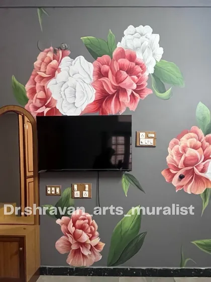 This floral piece came straight from the heart. The large, blooming peonies in shades of pink and white on a dark grey wall create a romantic and bold statement around the TV unit.