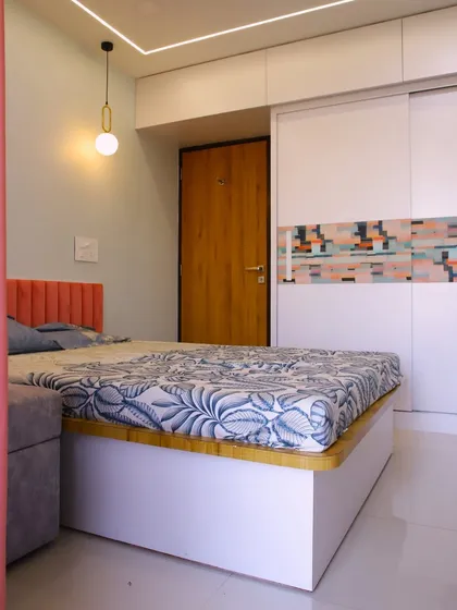 Another view of the room, highlighting the pendant light and the clean, contemporary lines of the furniture.