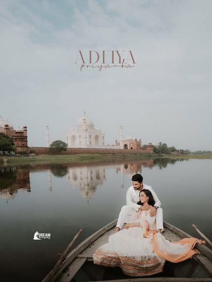 A serene portrait of the couple on a boat, with their names elegantly written above. This is a perfect shot for a personalized wedding invitation or save-the-date.