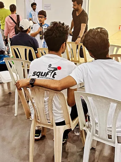 The team watching and supporting their teammates from the sidelines at the Sunil Verma Memorial Squash Championship. We win and lose as one.