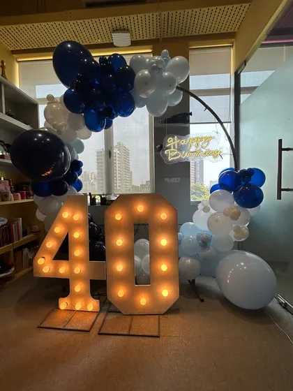 Another view of the stylish 40th birthday decor, showing how it fits perfectly into an office or modern event space.